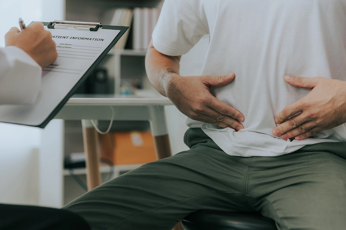 Patient speaking with a hernia doctor about suspected hernia.