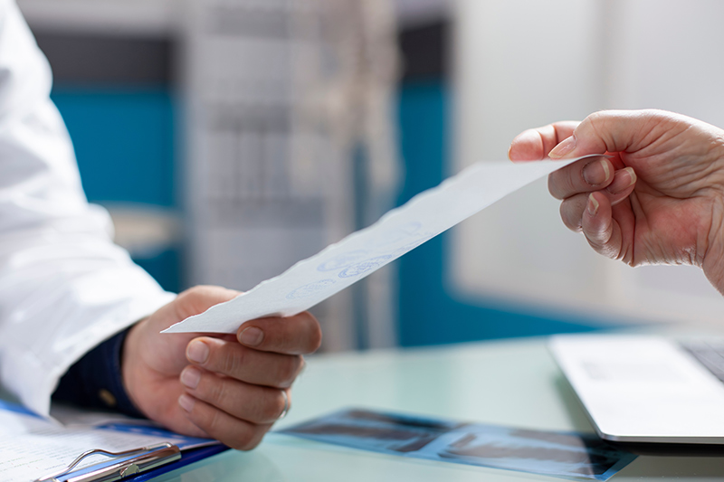 Person receiving a medical diagnosis from a healthcare professional