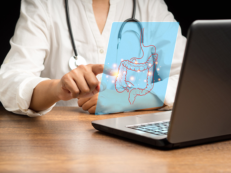 A doctor at his desk during a consultation session at the colon clinic